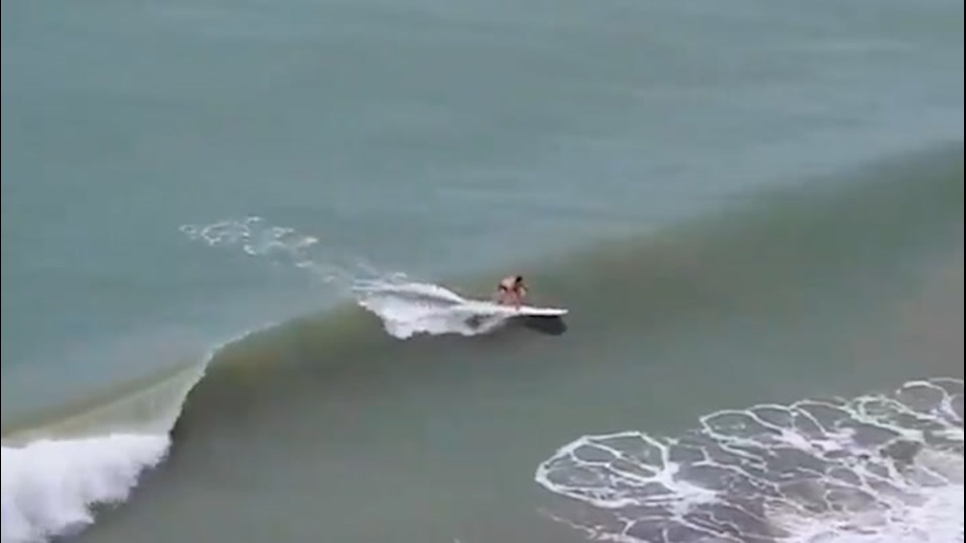 As Isaias churned off the coast of Florida on Aug. 2, surfers in Fort Lauderdale caught some waves.