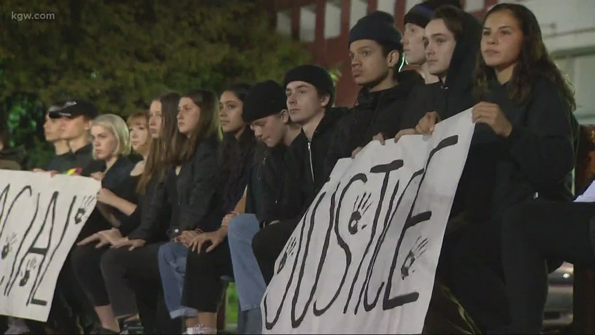 Dozens of students kneel during national anthem