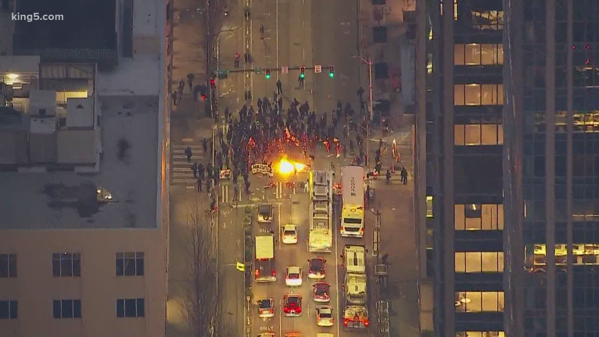 A group of demonstrators marched in downtown Seattle Wednesday and caused property damage. Seattle police made arrests.
