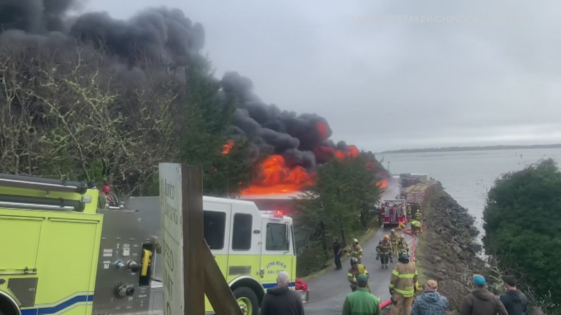 Fire crews spent all night and all morning dumping water on the remains of the Ilwaco Landing. No cause for the fire is clear.