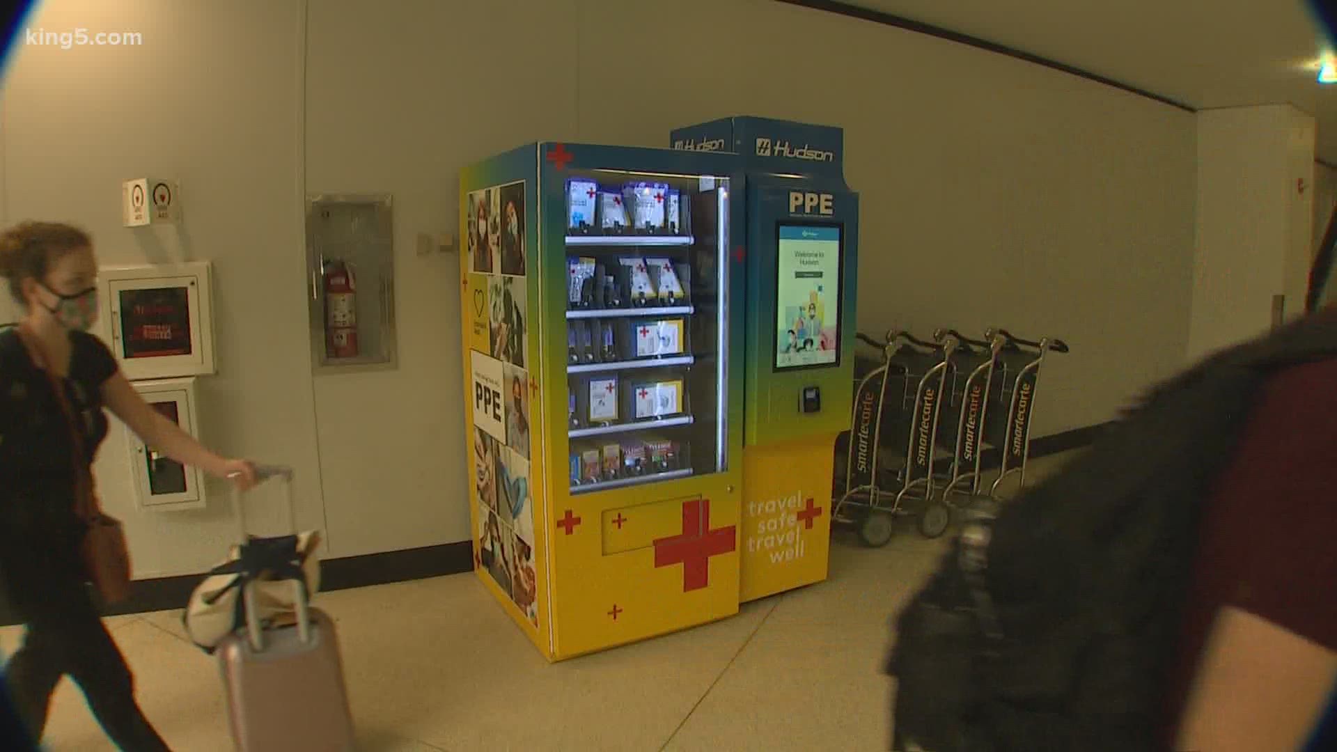 The first passenger temperature checks at Sea-Tac Airport start Tuesday. On Friday, the airport set up mask vending machines, and passengers are offered free masks.