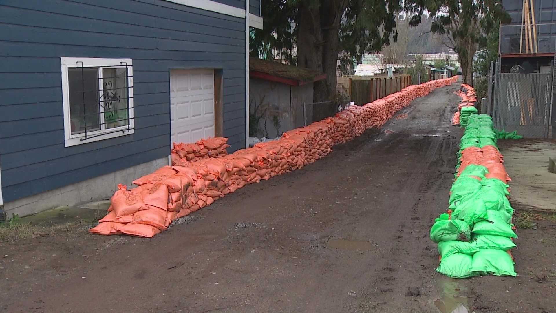 Forklifts carrying sandbags have been running nonstop, creating a barrier not just on the Duwamish but in alleys and at people’s front doors.