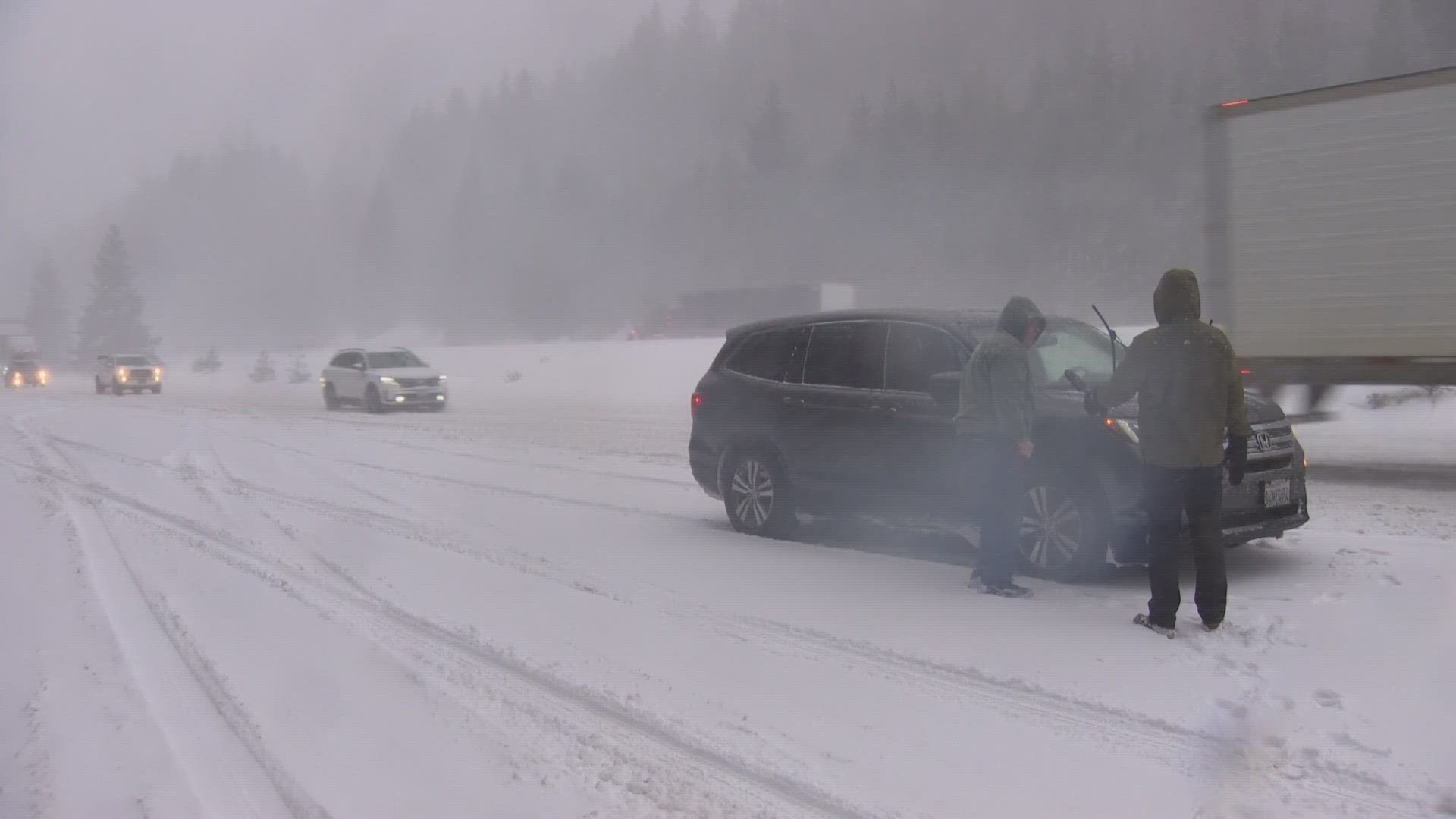 Travel on I-90 has been difficult following a storm that brought snow to the mountains and some lowland areas.