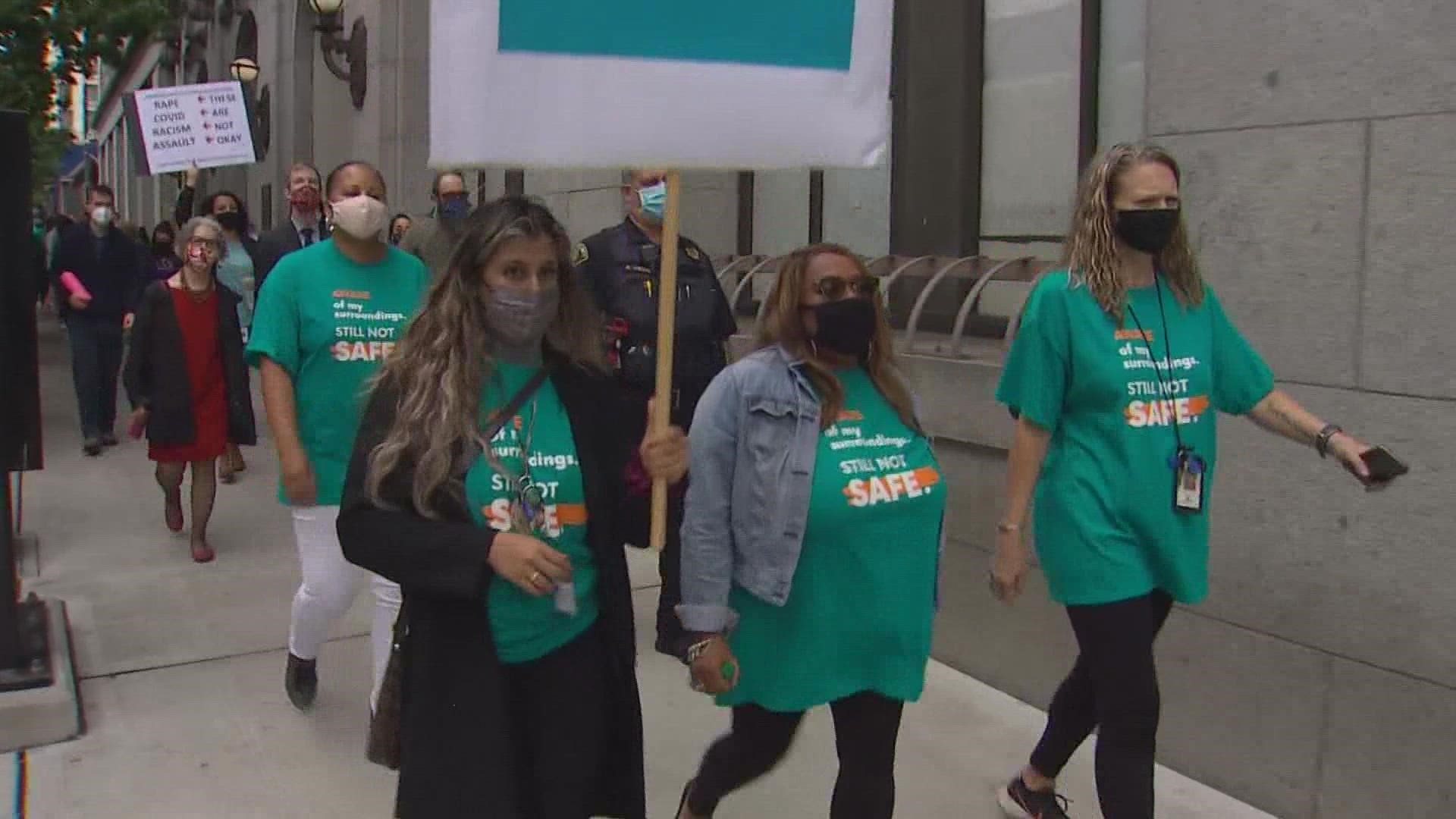 During a Friday rally, King County Courthouse employees shared numerous stories about being threatened and attacked.