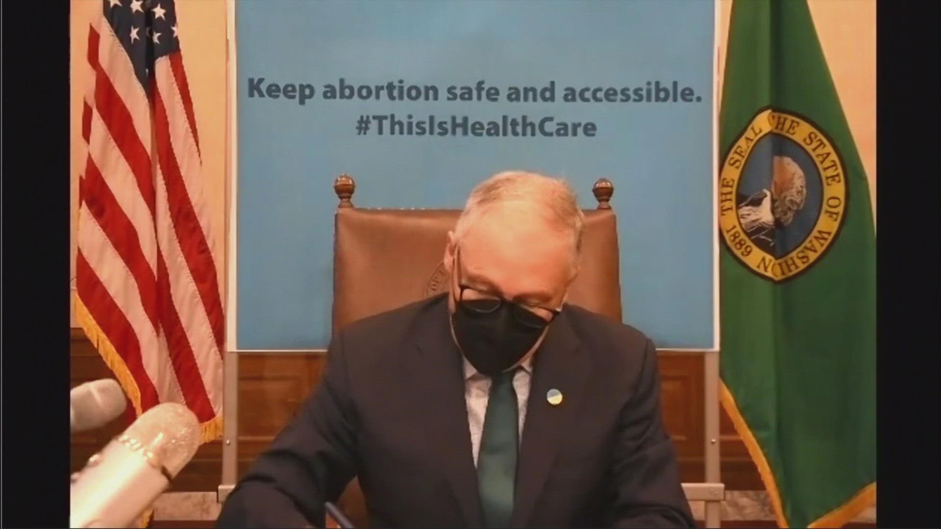Gov. Jay Inslee signed a measure into law Thursday prohibiting legal action against people seeking an abortion and those who aid them.