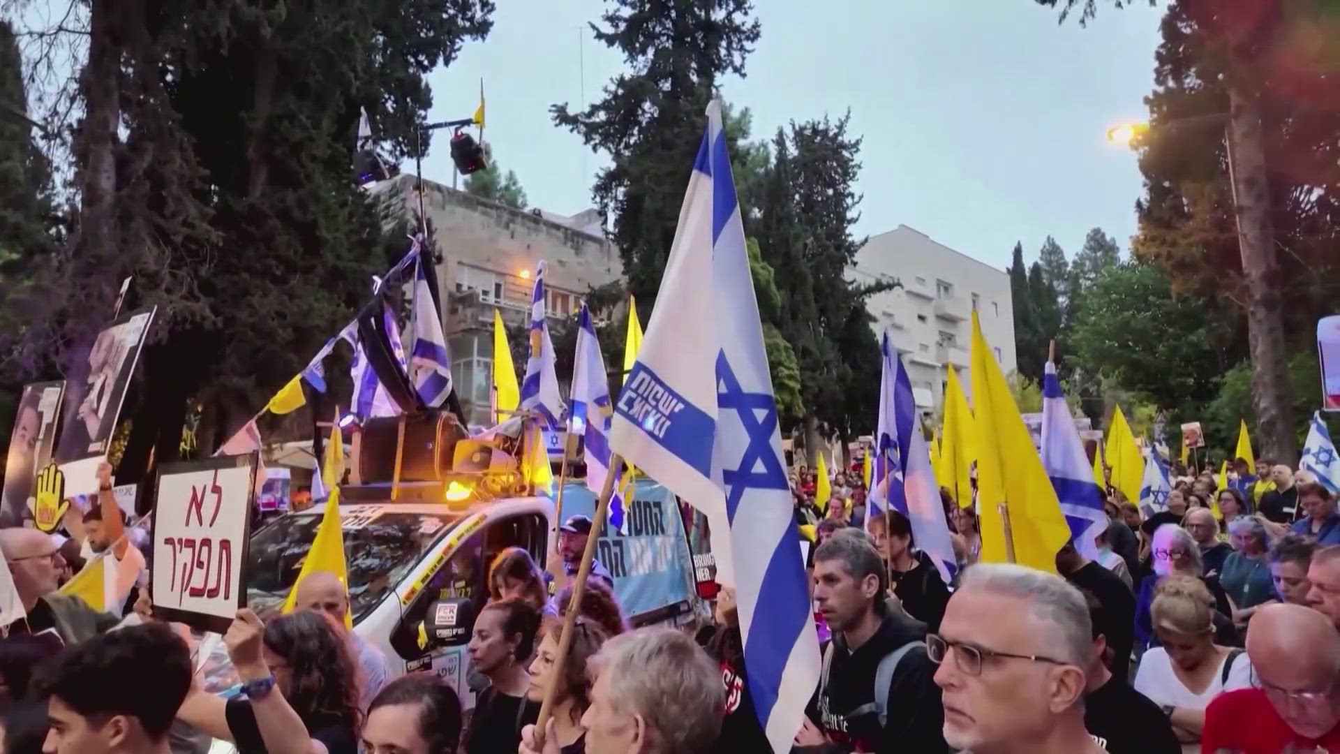 In Jerusalem, hostage families and protestors stood in silence as a siren sounded, marking the moment Hamas unleashed its brutal attack. Via: CBS News