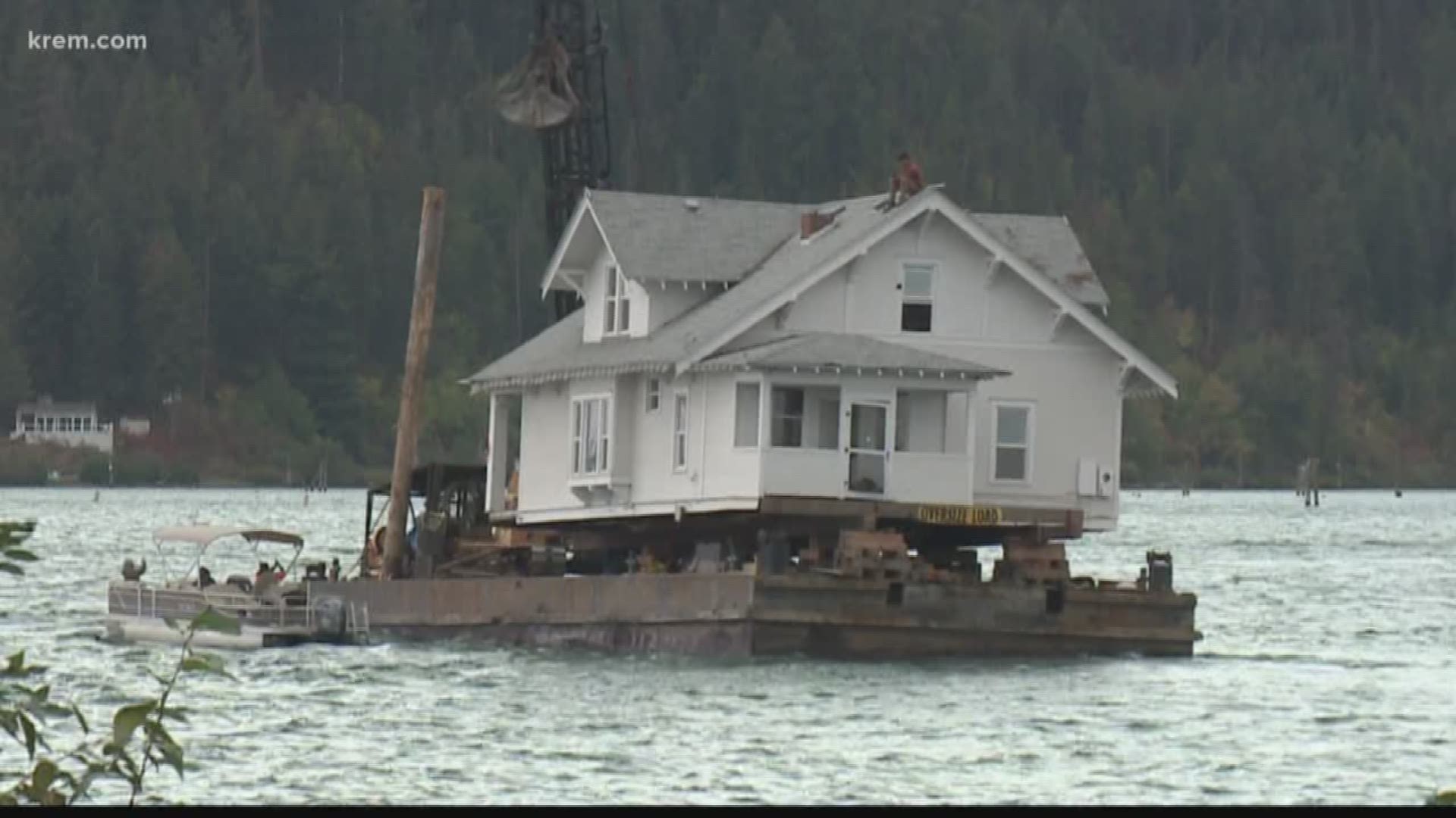 A local businessman bought the 115-year-old home and then was floated the home across the lake to another location.