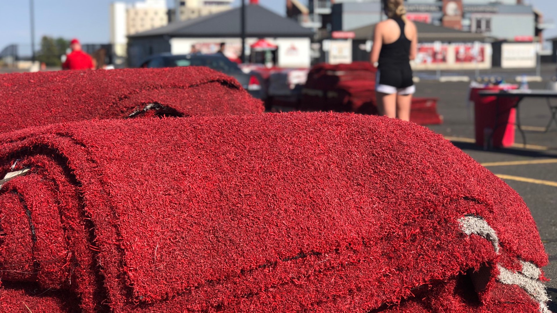 The school got new red turf this summer, so they decided to sell their old red turf to their fans.