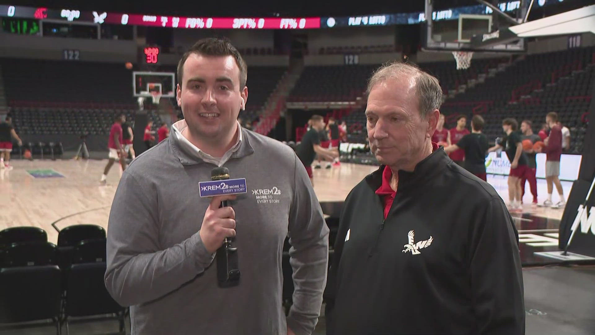 KREM 2 Sports Director Andrew Quinn chats with EWU Head Coach Dan Monson before the WSU vs EWU game.