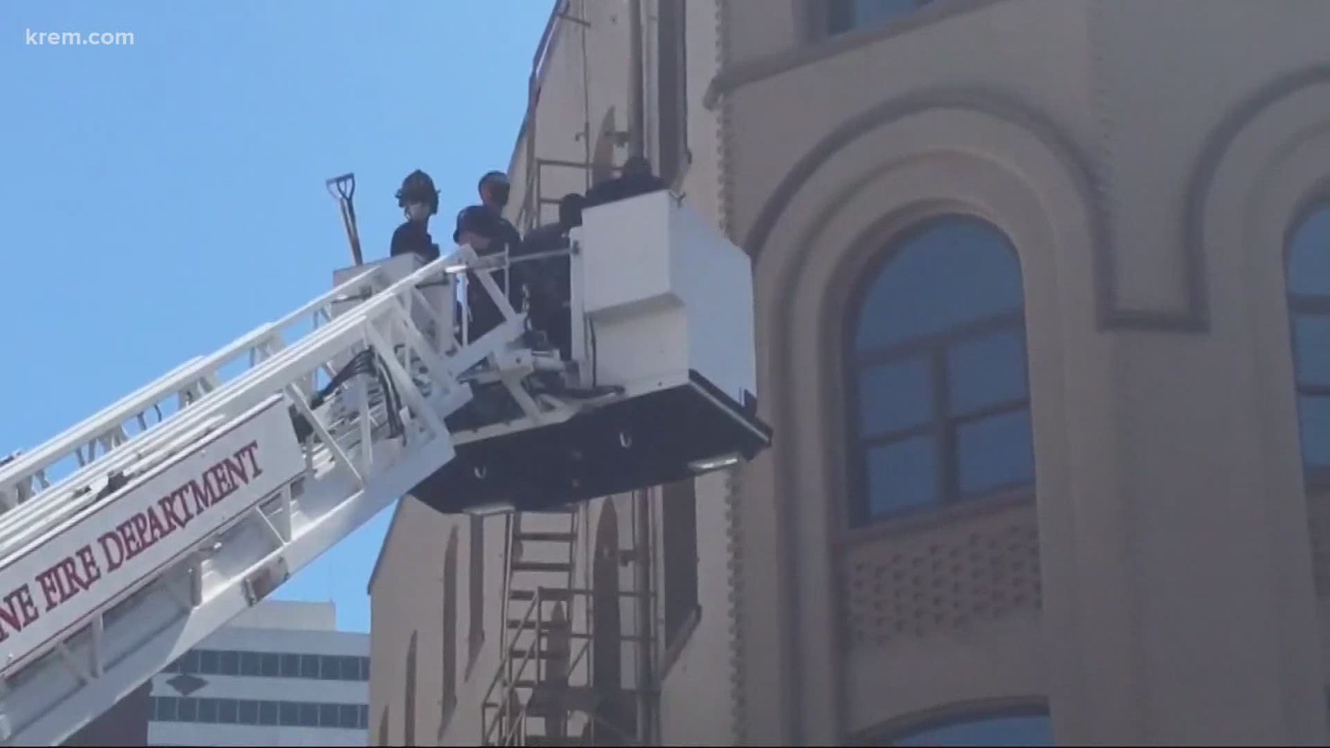 The suspect climbed onto the roof of 24 Taps in downtown Spokane to evade police after a foot pursuit, authorities said.