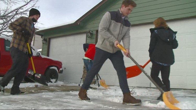 Group of missionaries help Spokane residents clear paths on the South Hill