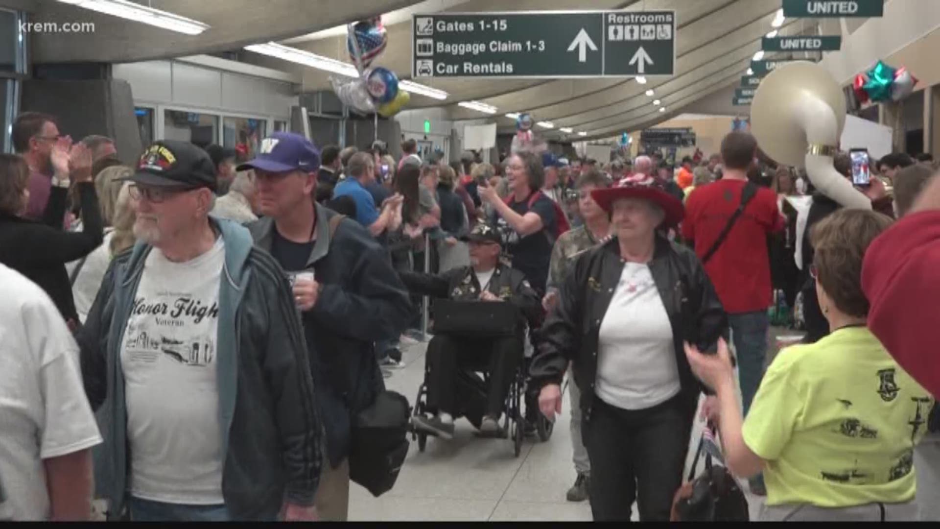 Hundreds showed up at the GEG terminal to cheer for veterans returning from their trips to D.C. memorials.