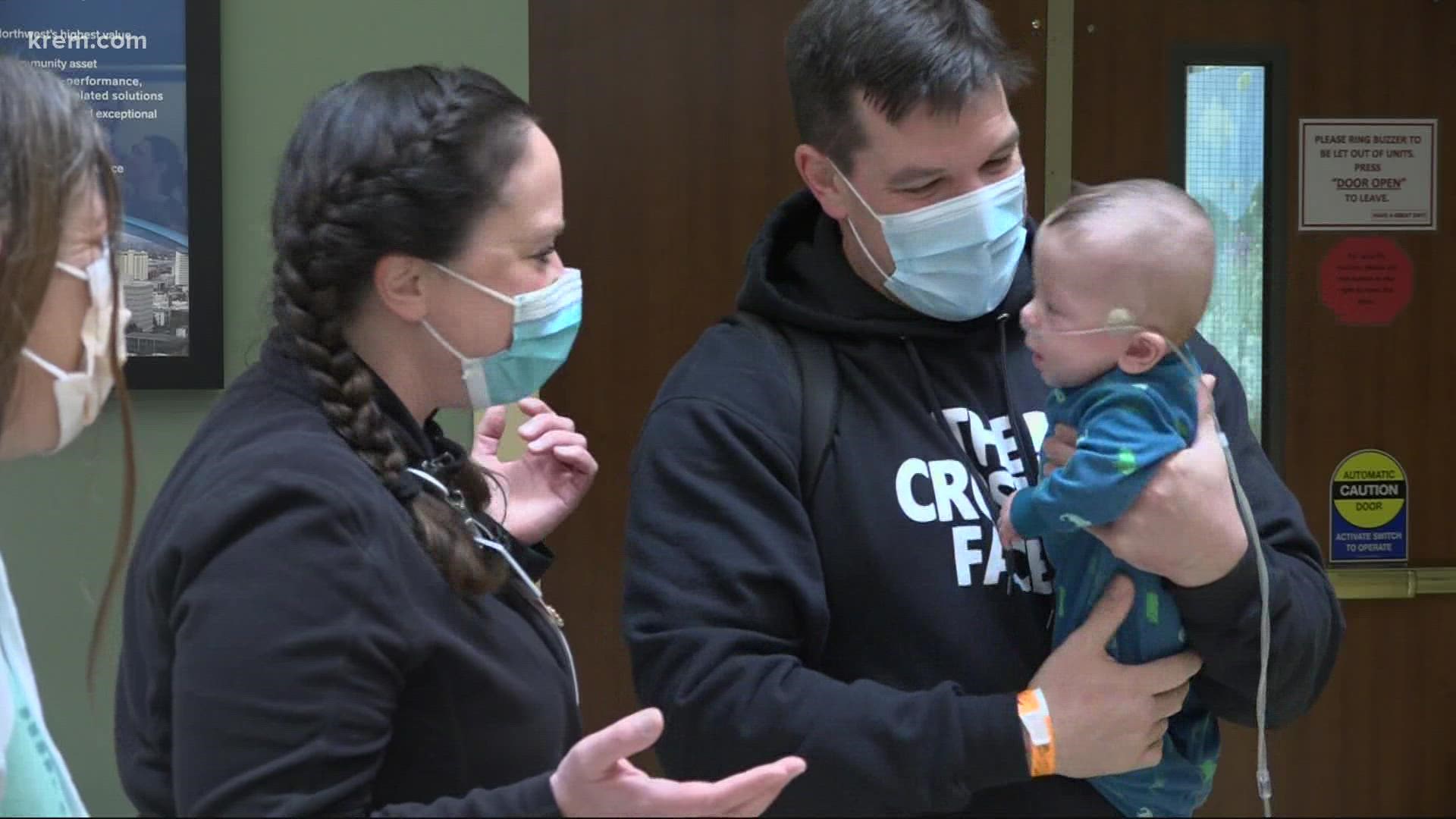 Christina Roach and Aaron Carr showcase the growth of their son to the healthcare workers who gave him a fighting chance at Deaconess Hospital.