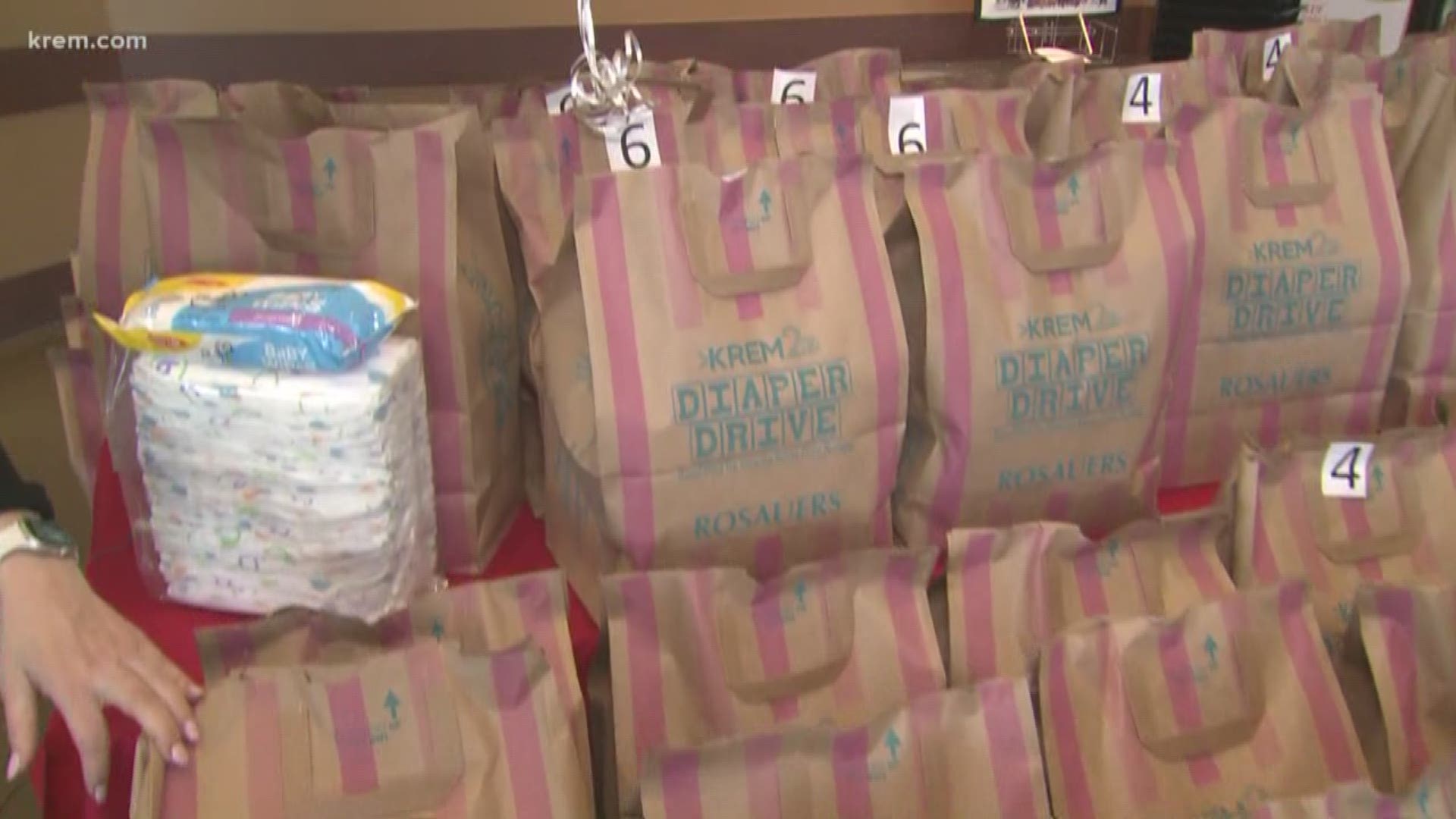 Each time you buy a KREM 2 Diaper Drive bag it helps provide a family with diapers for a week.