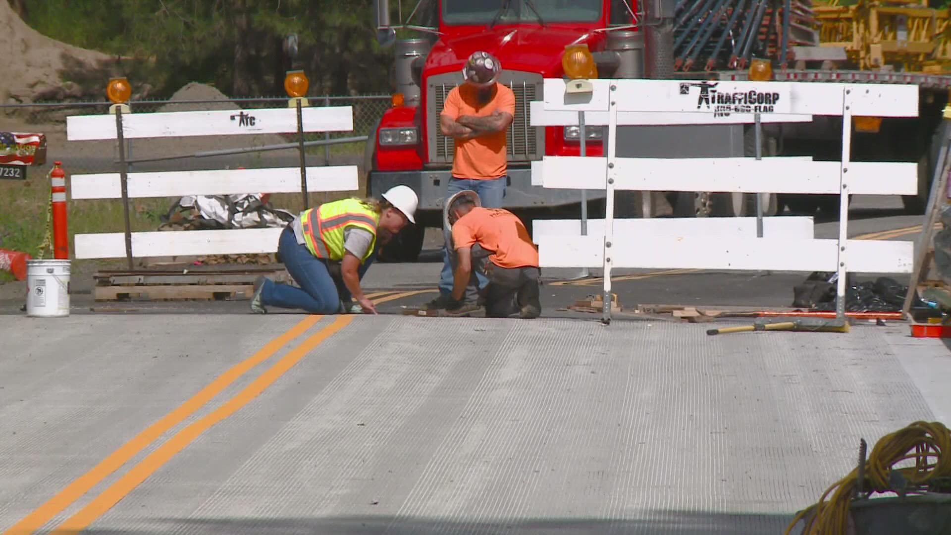 The City of Spokane said they are still working to wrap up construction work on the Hatch Road Bridge but still plan to reopen ahead of time.