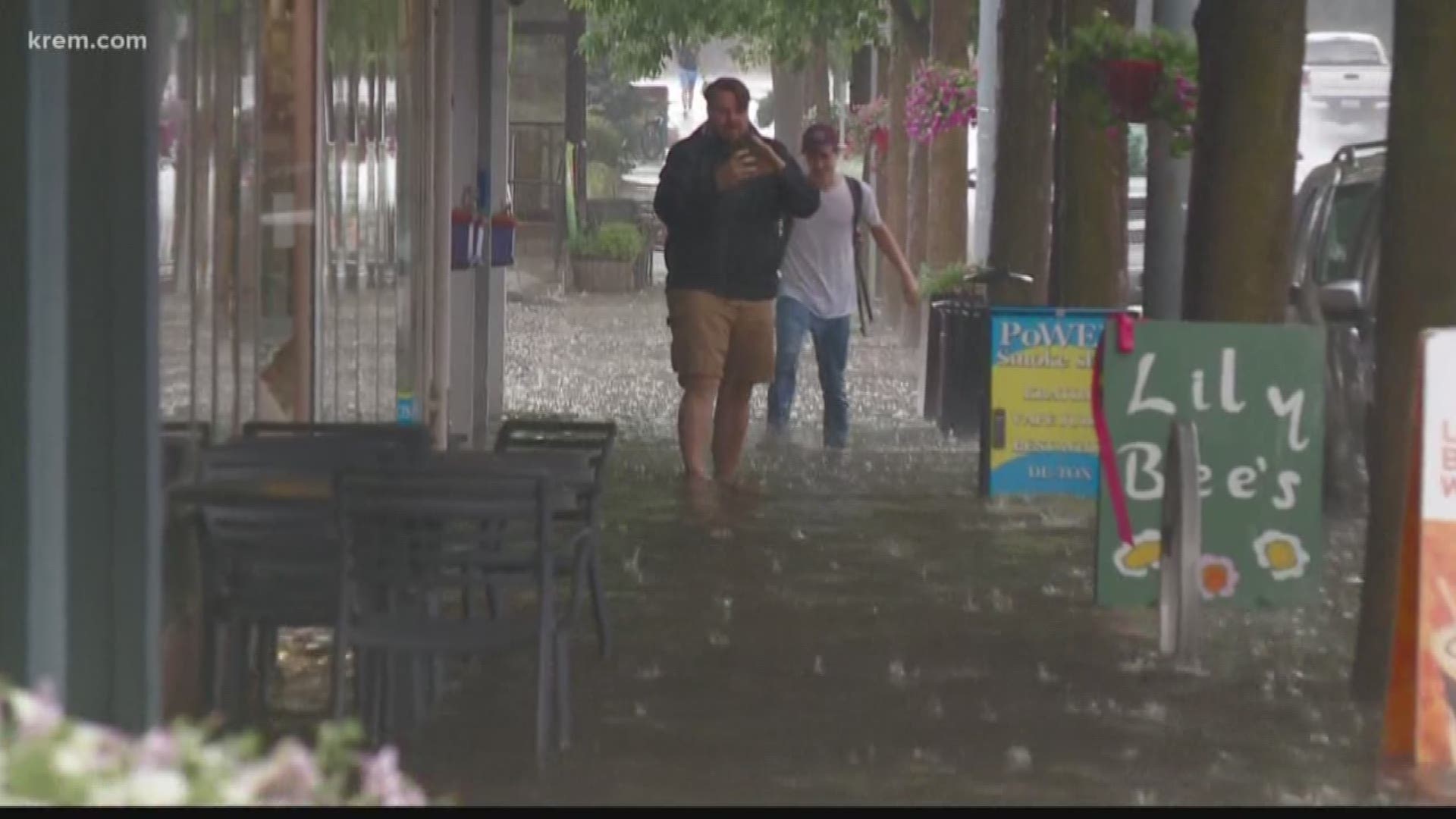 KREM 2 photographer Roger Hatcher said it started to pour in the area around 2:30 p.m. He saw people walking down a sidewalk with water up to their shins.