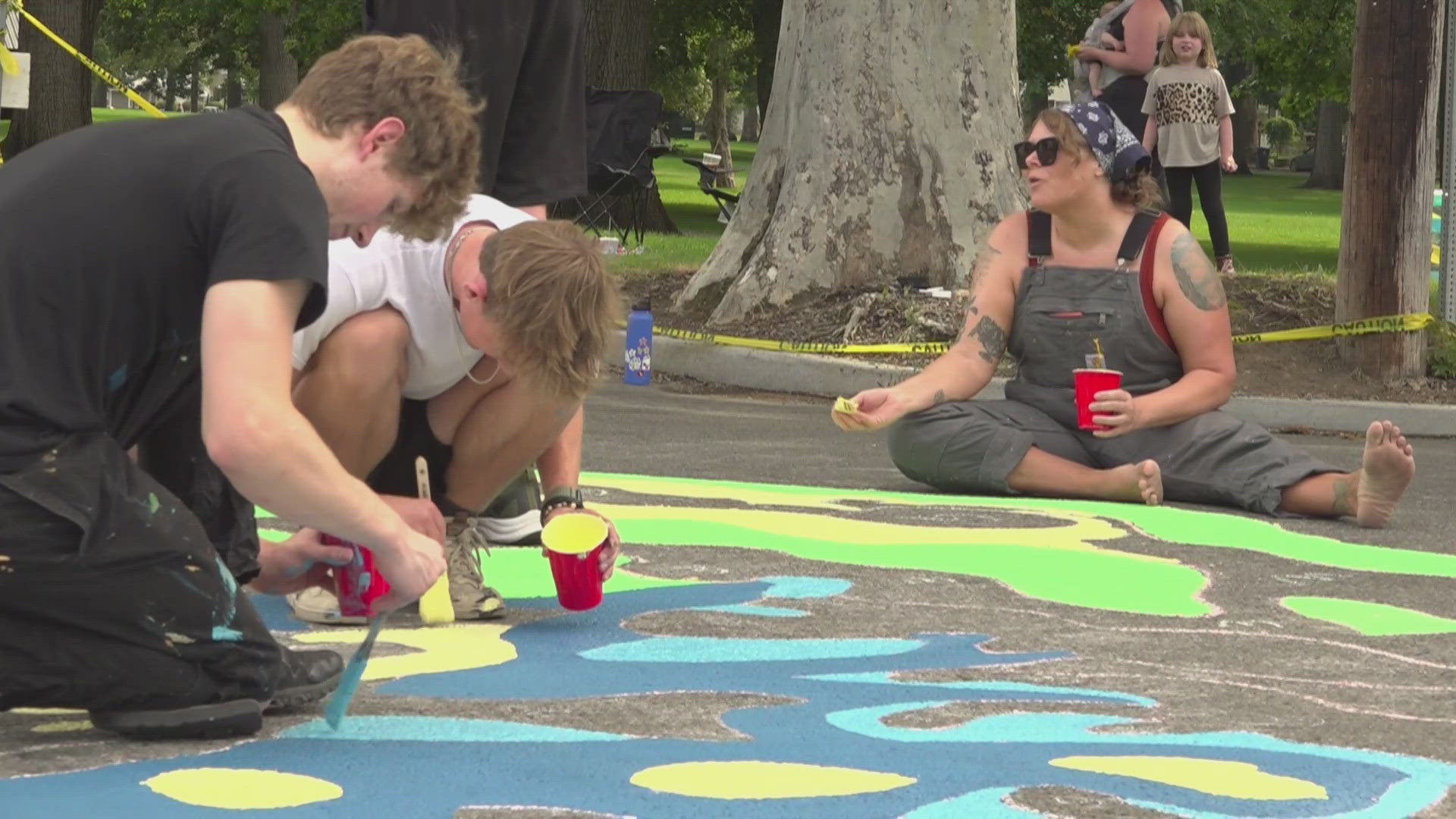 Spokane Arts says the "asphalt art" installations aim to slow drivers down and calm them, enhancing safety and beauty for everyone.