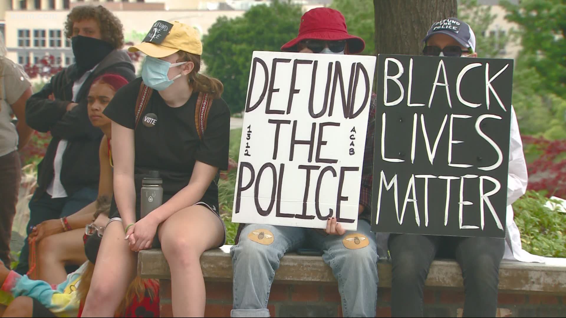 The protesters are demonstrating against a police guild contract that the Spokane City Council is scheduled to vote on Monday night.