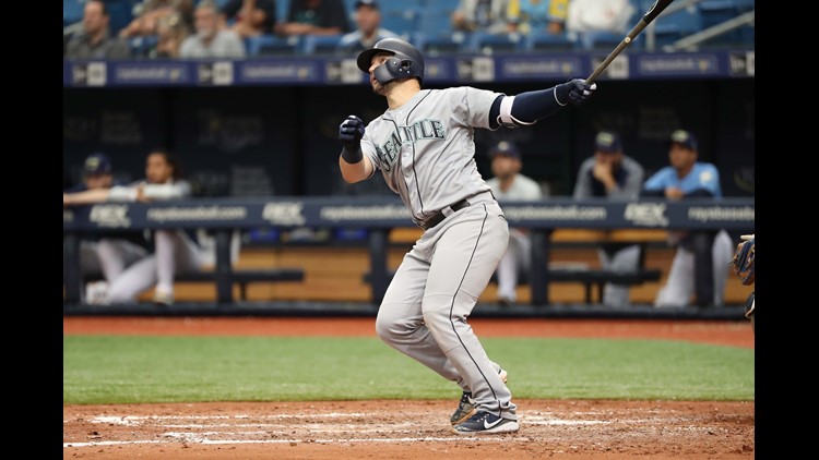 Seattle Mariners' Kyle Seager watches his three-run double against