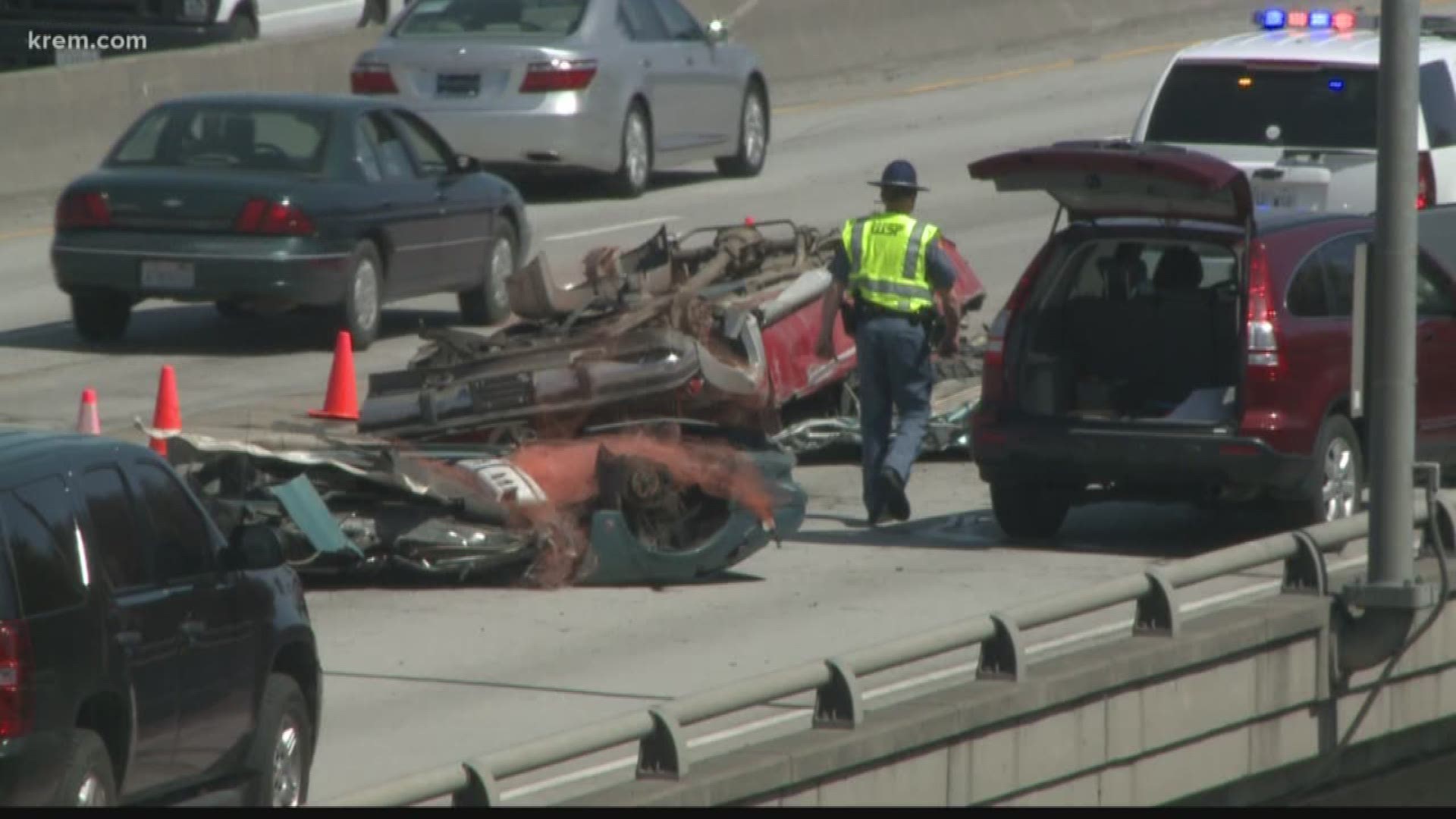 A semi-truck carrying crushed cars lost its load on I-90 near the maple street exit.