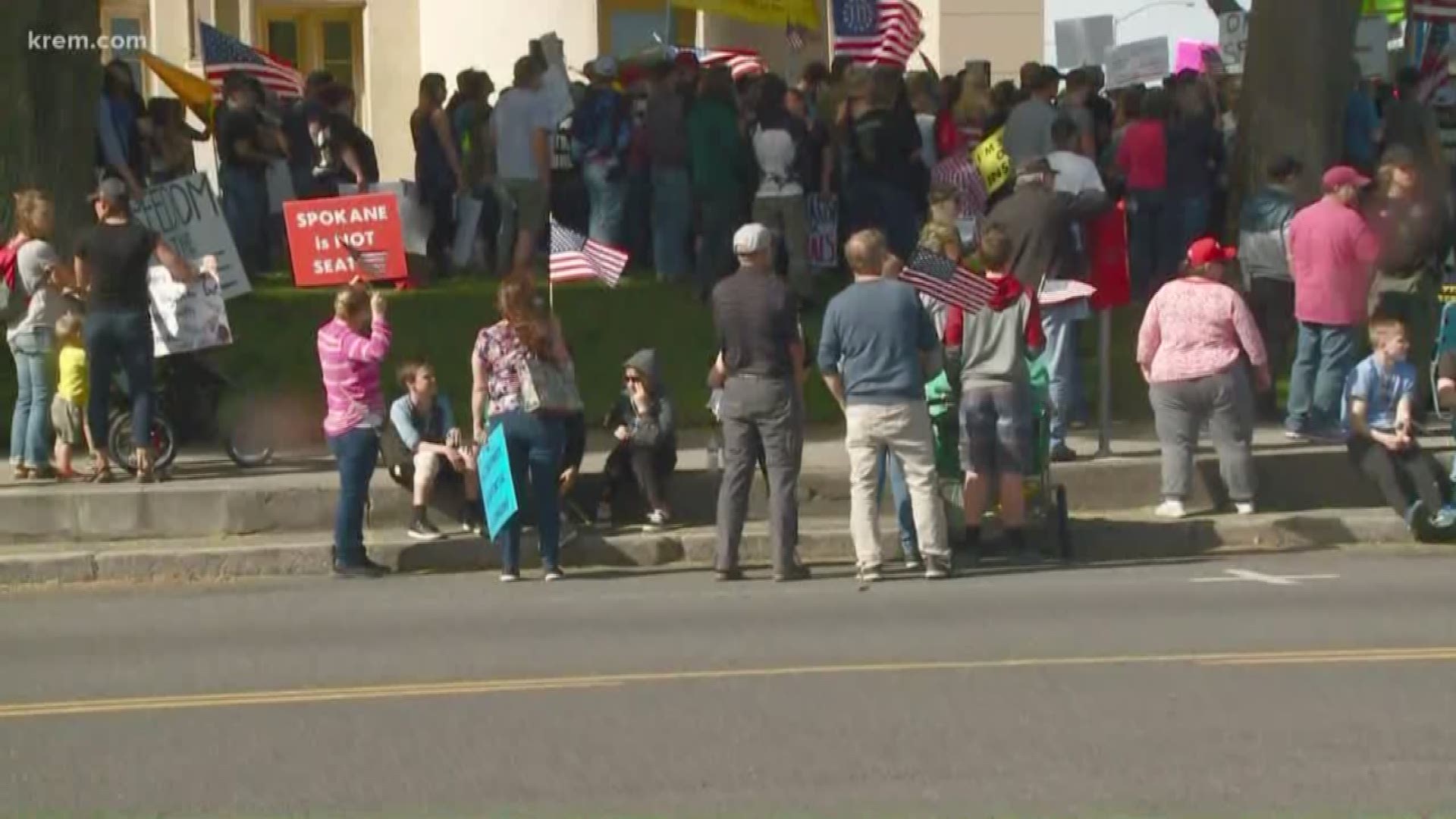 Speakers and protesters attending the rally, including Spokane Valley Rep. Matt Shea, chanted, "Freedom is the cure."
