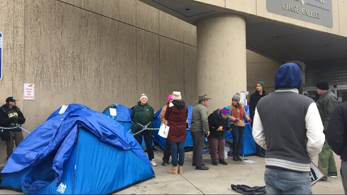 Protesters chained together at Spokane city hall in response to