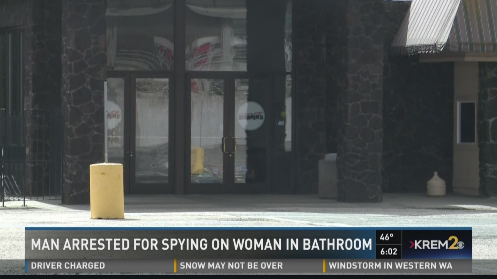 According to court documents, the woman caught Beatson sticking his head under the bathroom stall and looking at her.