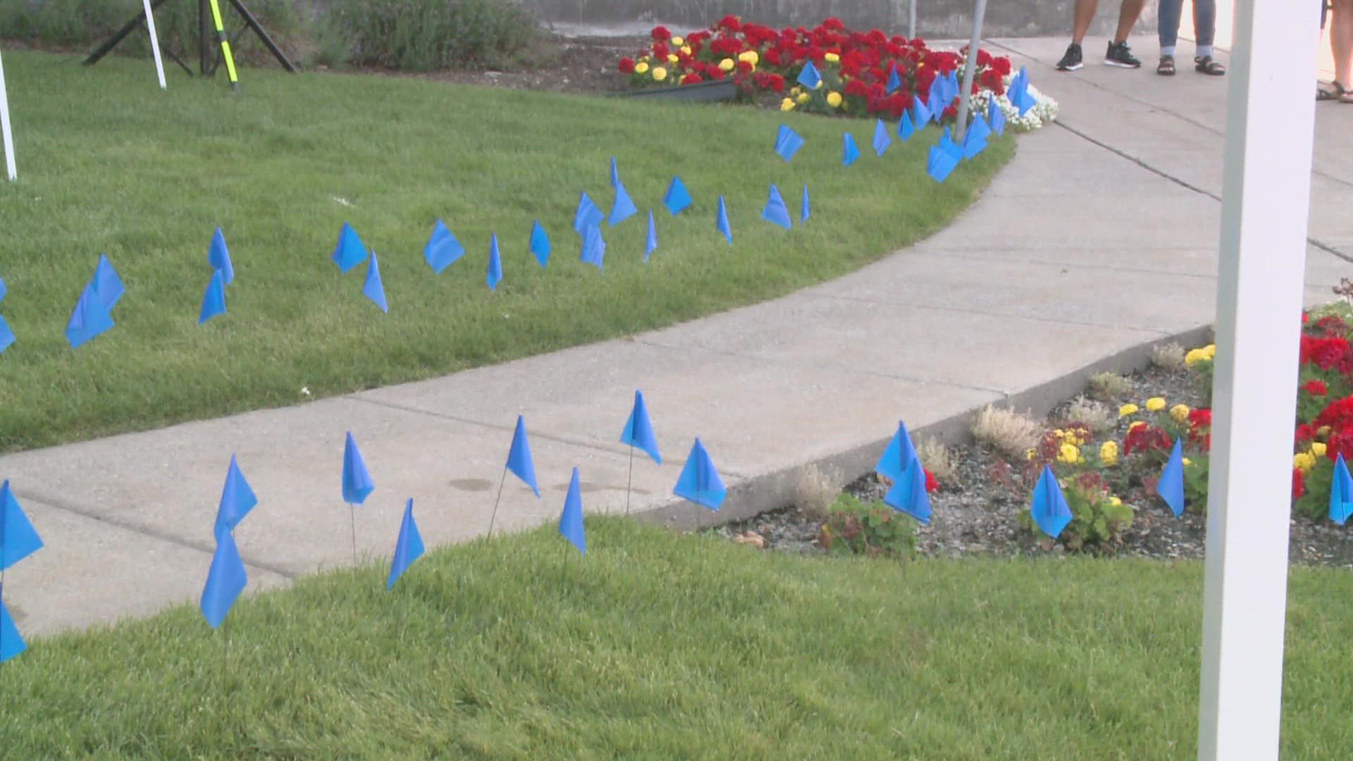 As part of the memorial, MultiCare placed blue flags in the ground to honor the roughly 14-000 local patients who lost their lives to COVID.