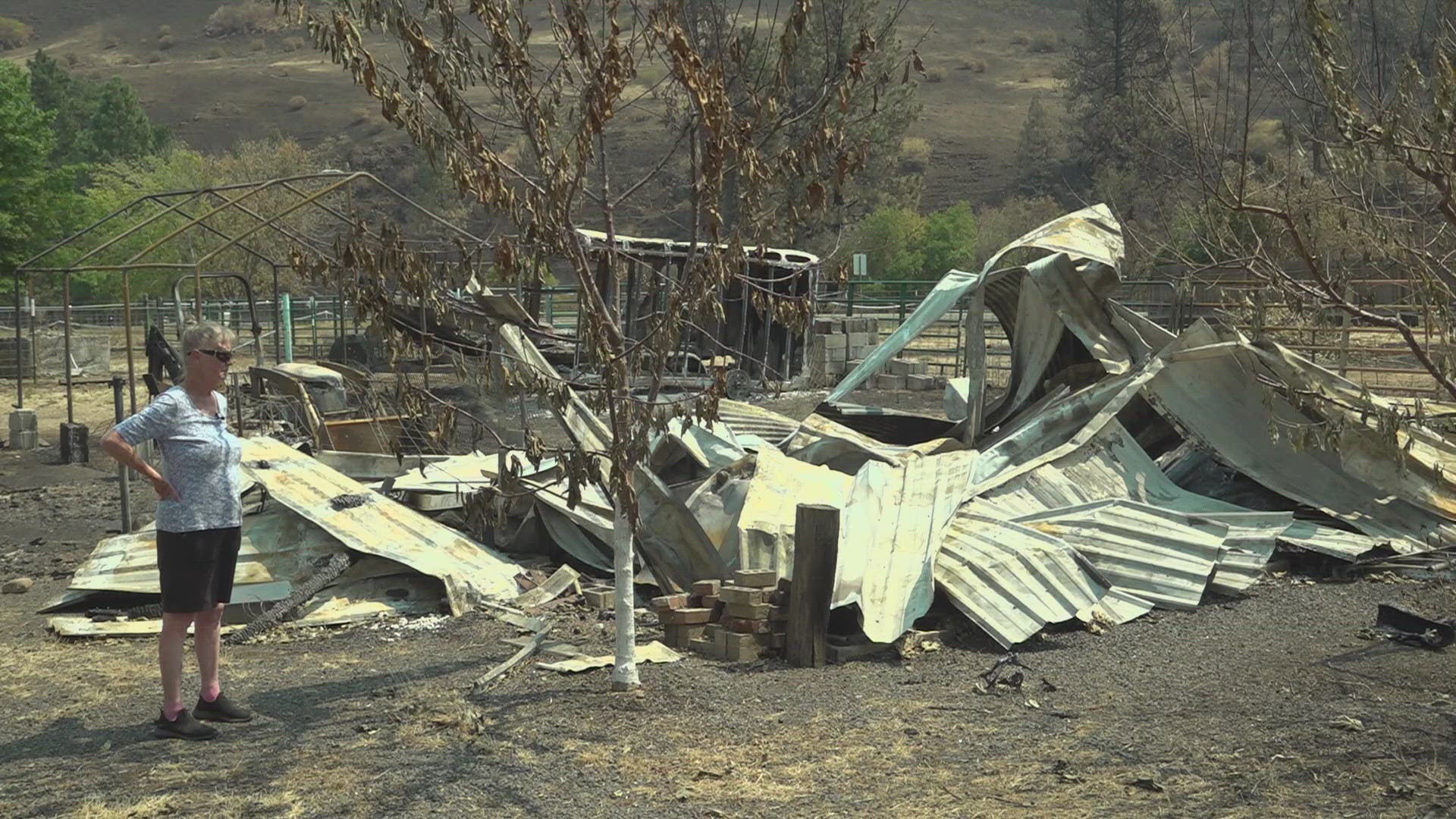 The Gwen Fire has burned over 28,000 acres, and one neighbor in the community says the fire hit her property and narrowly missed her house.