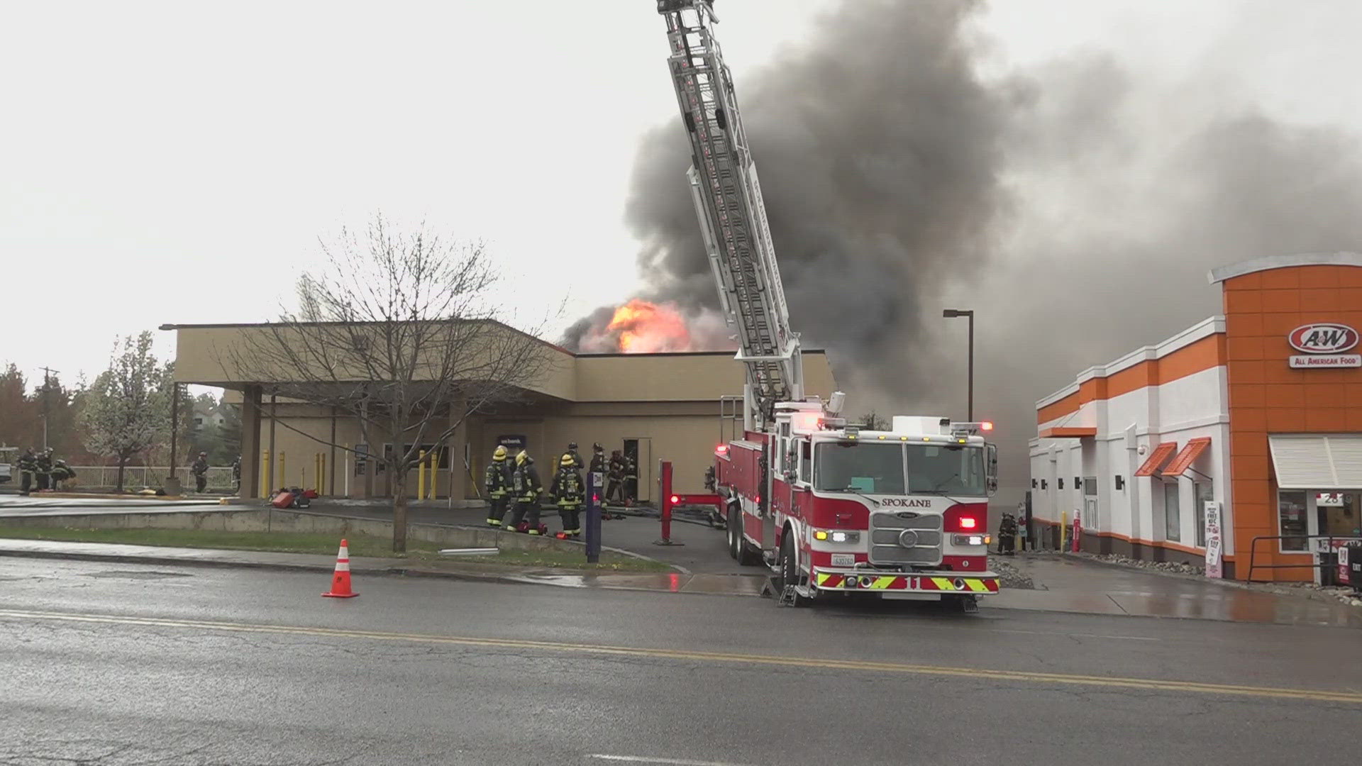 Firefighters were inside the bank when the roof collapsed.