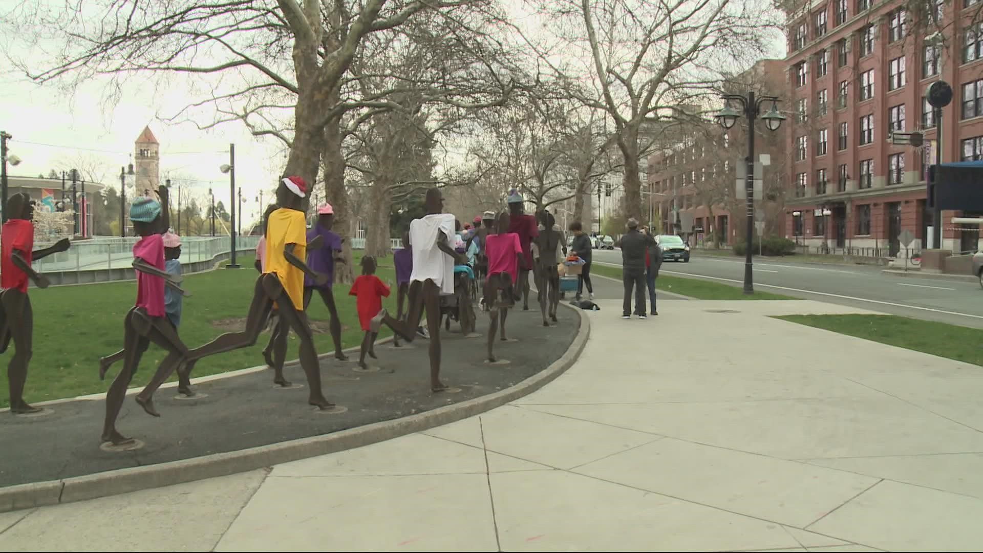 Lala Gerber has been decorating the running metal statues in Riverfront Park since 1997.