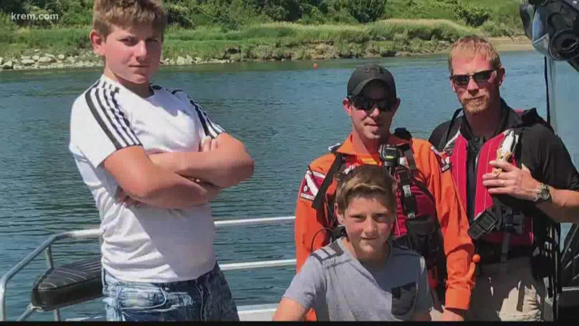 William Johnson, 14, and Brennan Johnson, 11, were made honorary members of Boundary County's search and rescue squad after saving the life of a 9-year-old boy.
