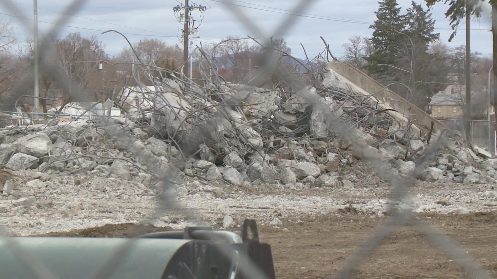 Crews demolished the last of the Magnolia Street bridge and cleaned up fallen debris on both sides of the highway.