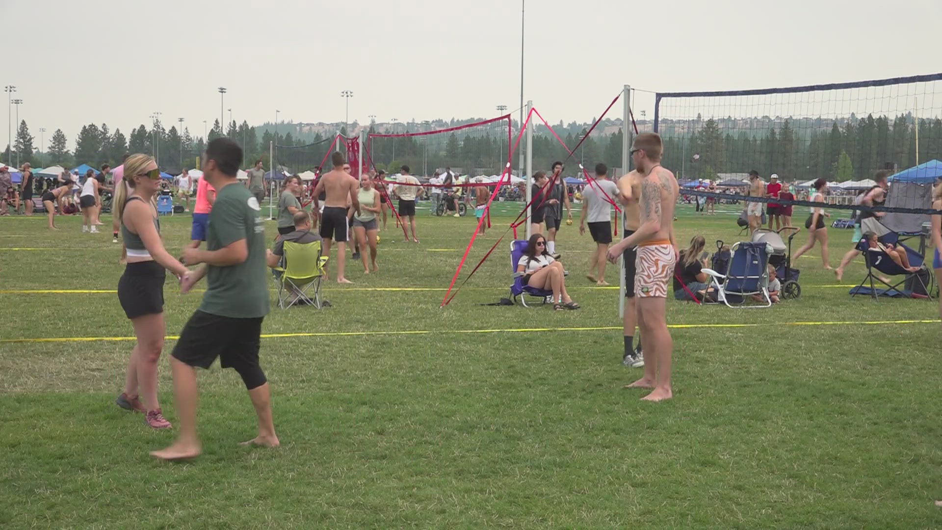 Despite the smoke and heat, thousands of volleyball players and fans are enjoying the Spike & Dig tournament.