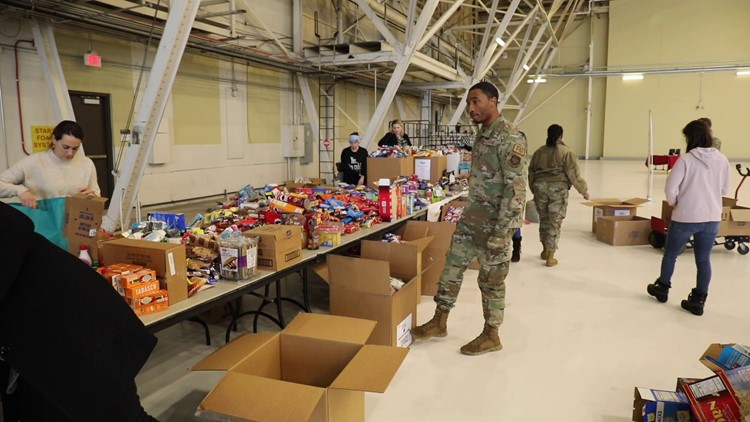 Volunteers from Fairchild Air Force Base package Treats 2 Troops boxes