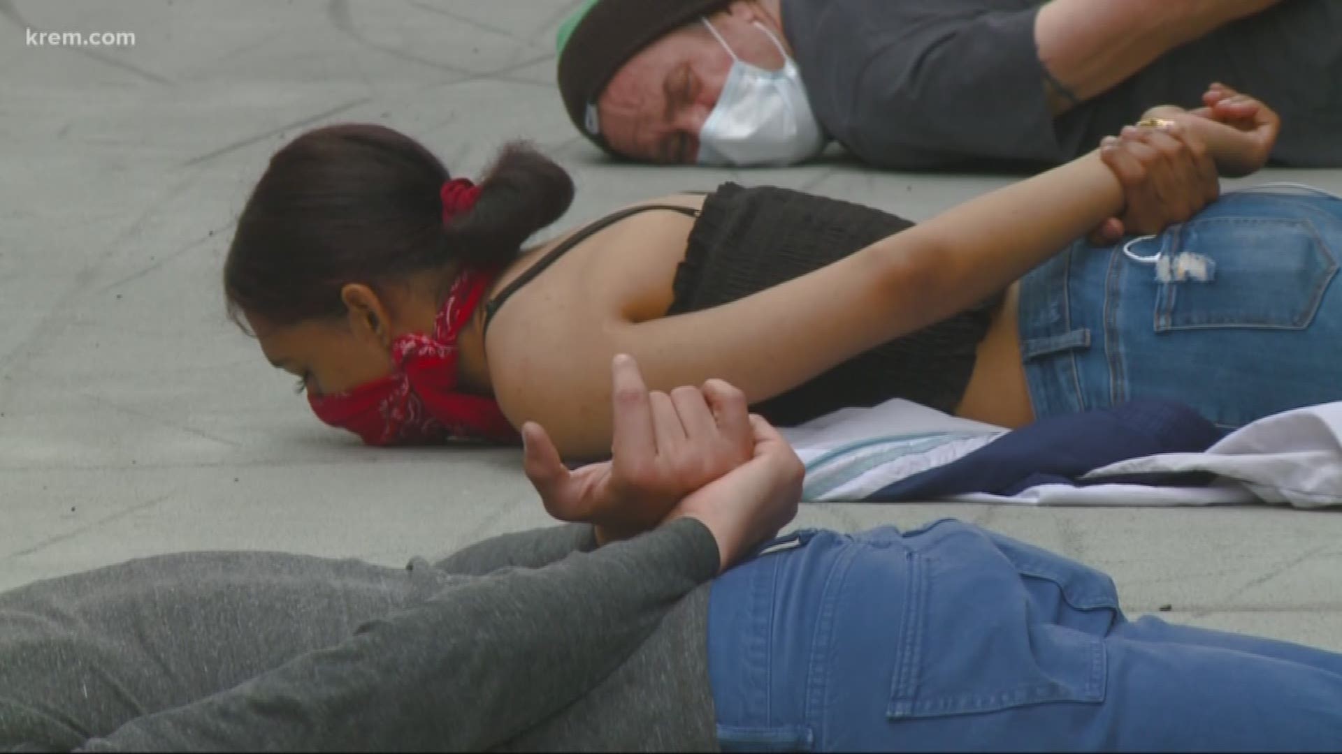 The protesters laid on the ground during the demonstration, with many putting their hands behind their back.