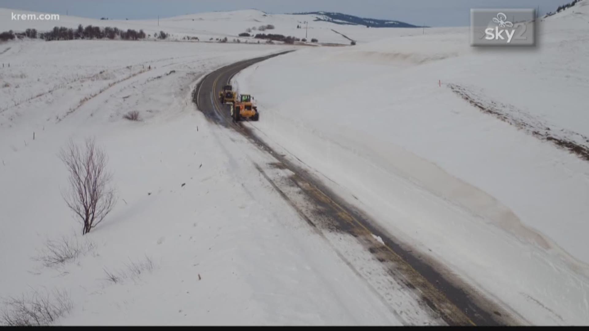 Spokane county plow crews work to clear highway 27 of large snow drifts.