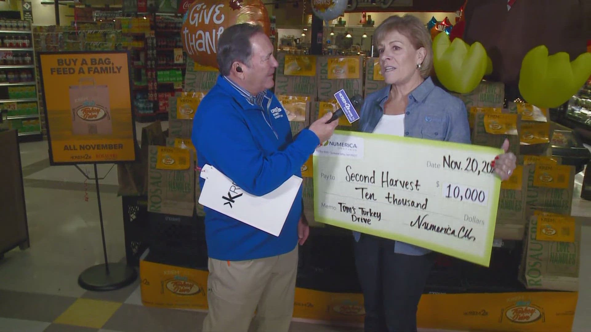 Numerica's CEO Carla Cicero surprised Tom Sherry with a $10,000 donation for Tom's Turkey Drive!