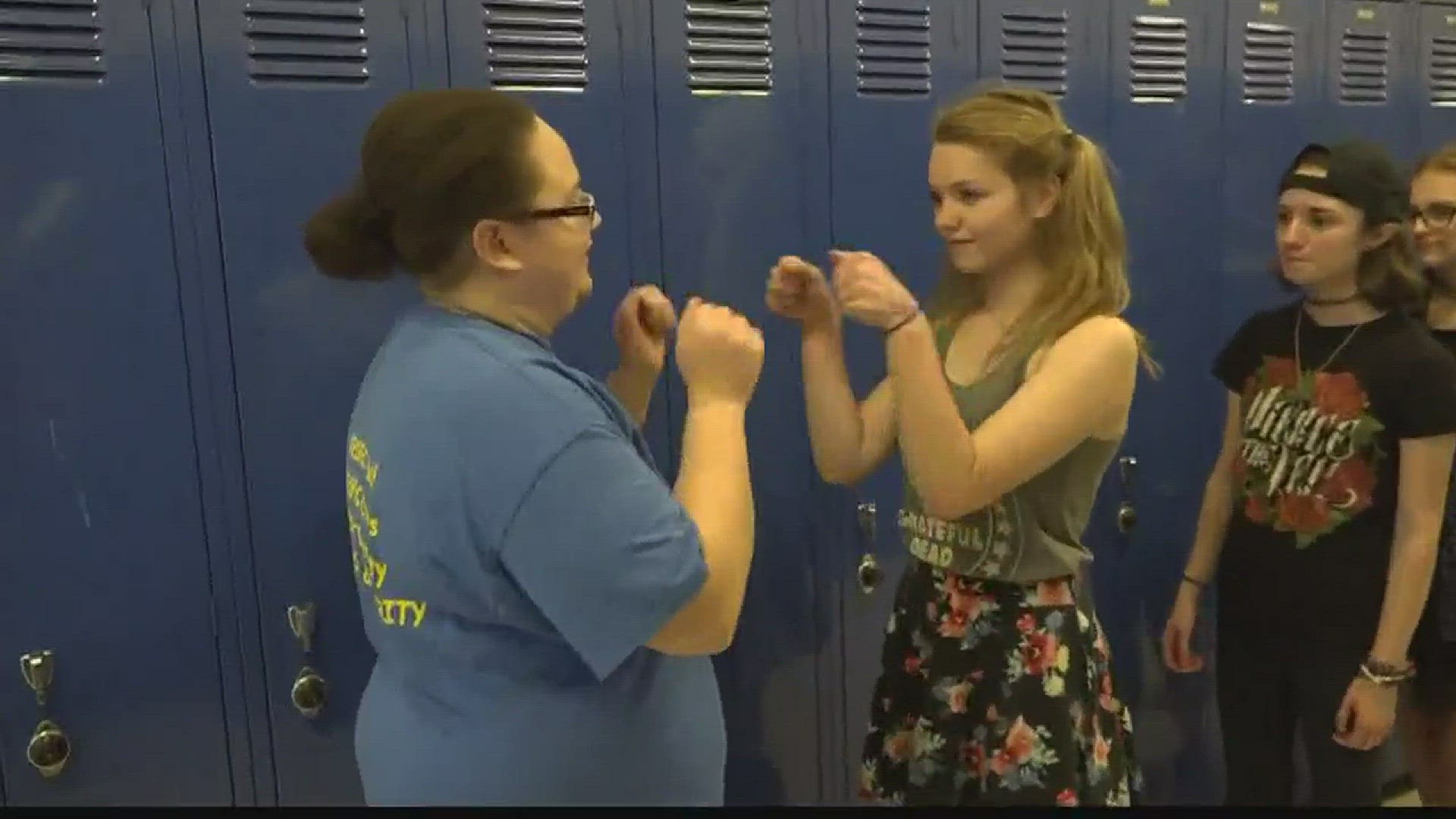 Azalyn Croft is an eighth-grade English teacher at Glover Middle School who took the time to create almost 80 handshakes as a way to connect with each of her students.