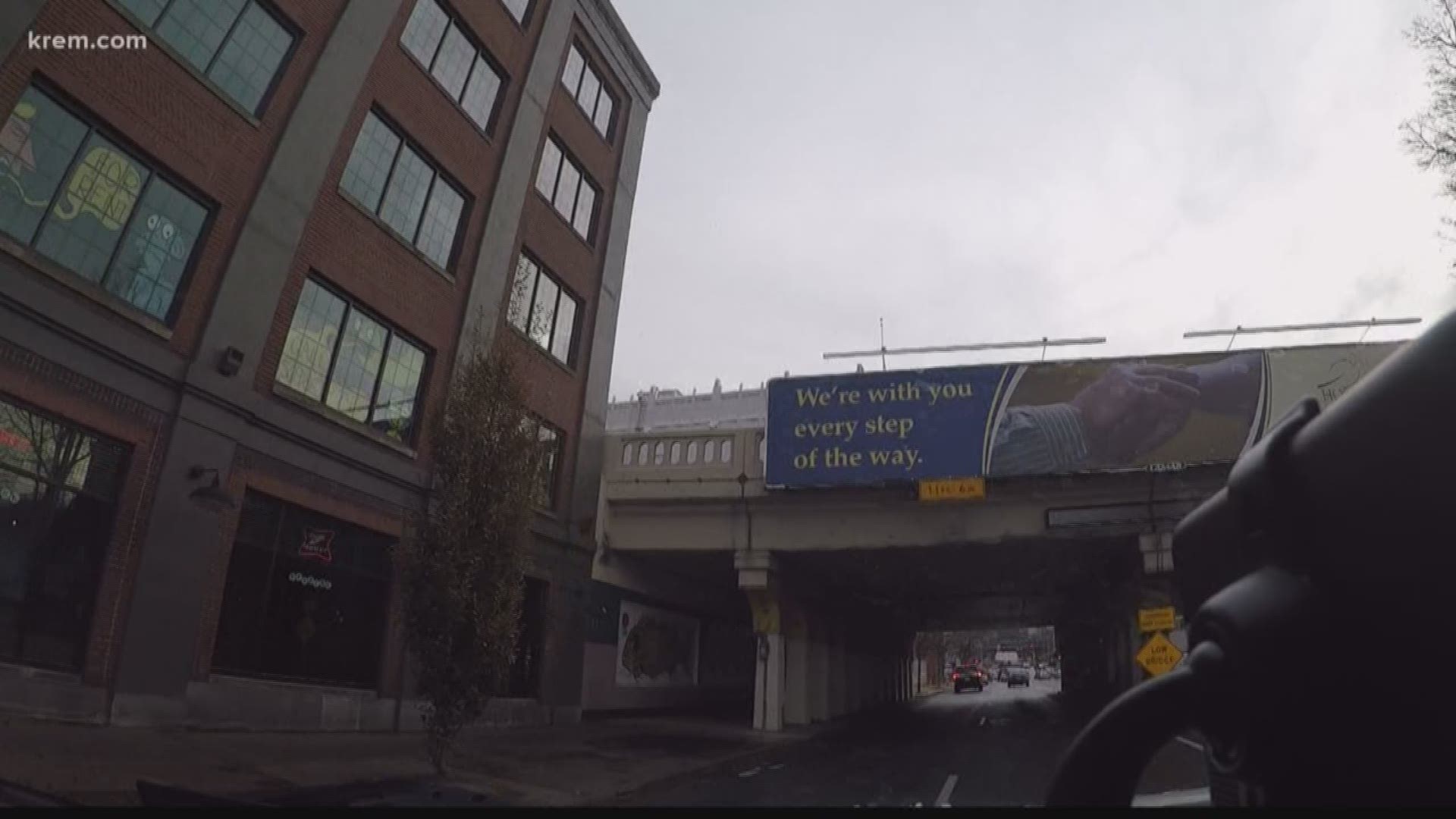 The height limit at the overpass is 11 feet, six inches, and anything above that height will pass through lasers and trigger flashing lights.