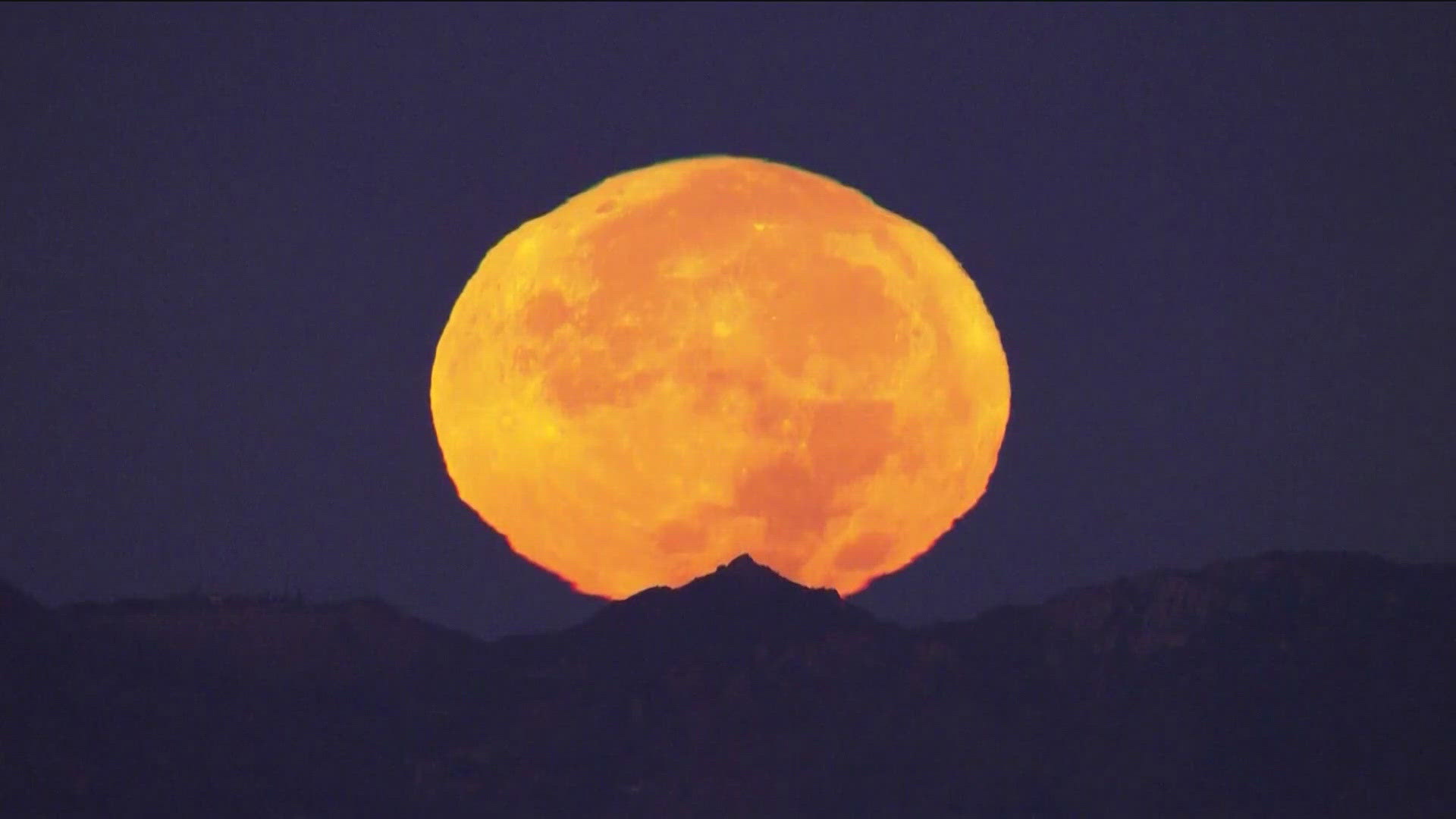 A supermoon is when the moon's orbit swings closer to the Earth, making it look extra big. As the third full moon in a season with four full moons, it's a blue moon.