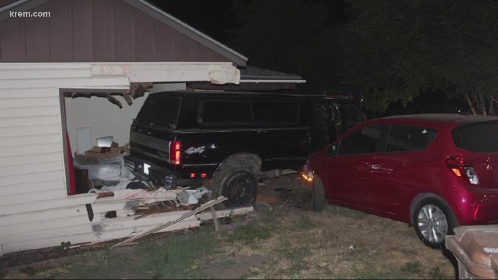 A driver was arrested for driving under the influence after crashing into the bedroom of a Spokane home, on top of a bed where two people were sleeping.