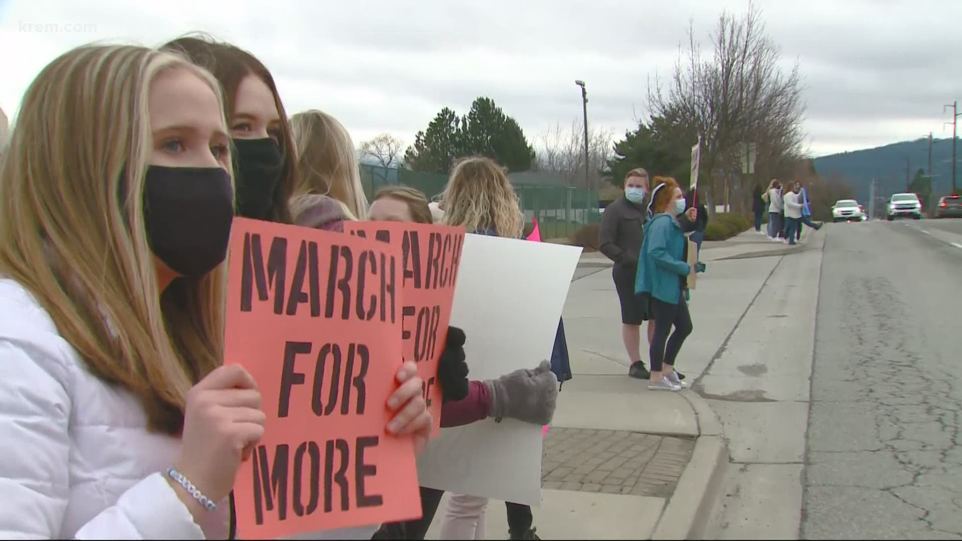 At least three dozen protesters lined up outside Central Valley High School demanding a change to the district's phased-in approach for a return to classrooms.
