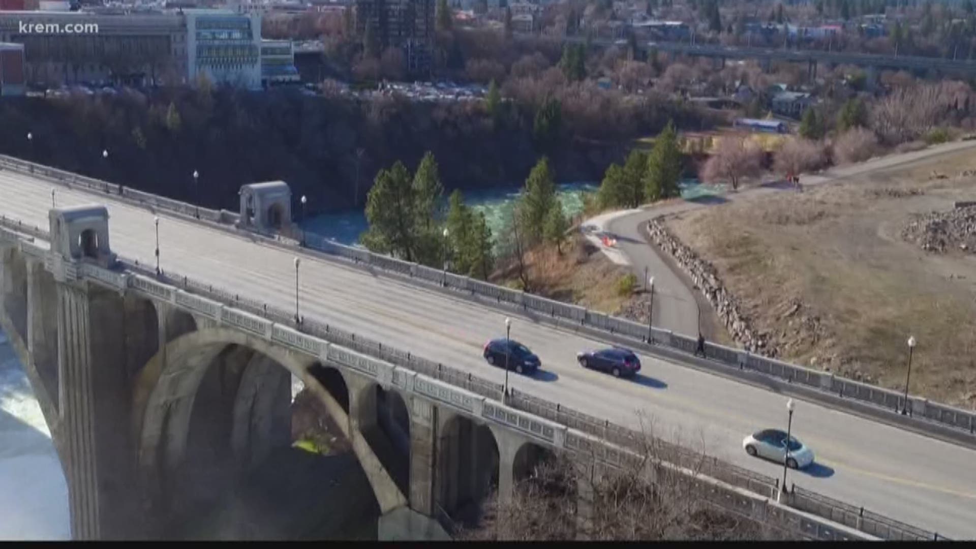 The zip line would start at a plaza overlooking the river next to the library, travel under the first small arch of the Monroe Street Bridge and land in Glover Park