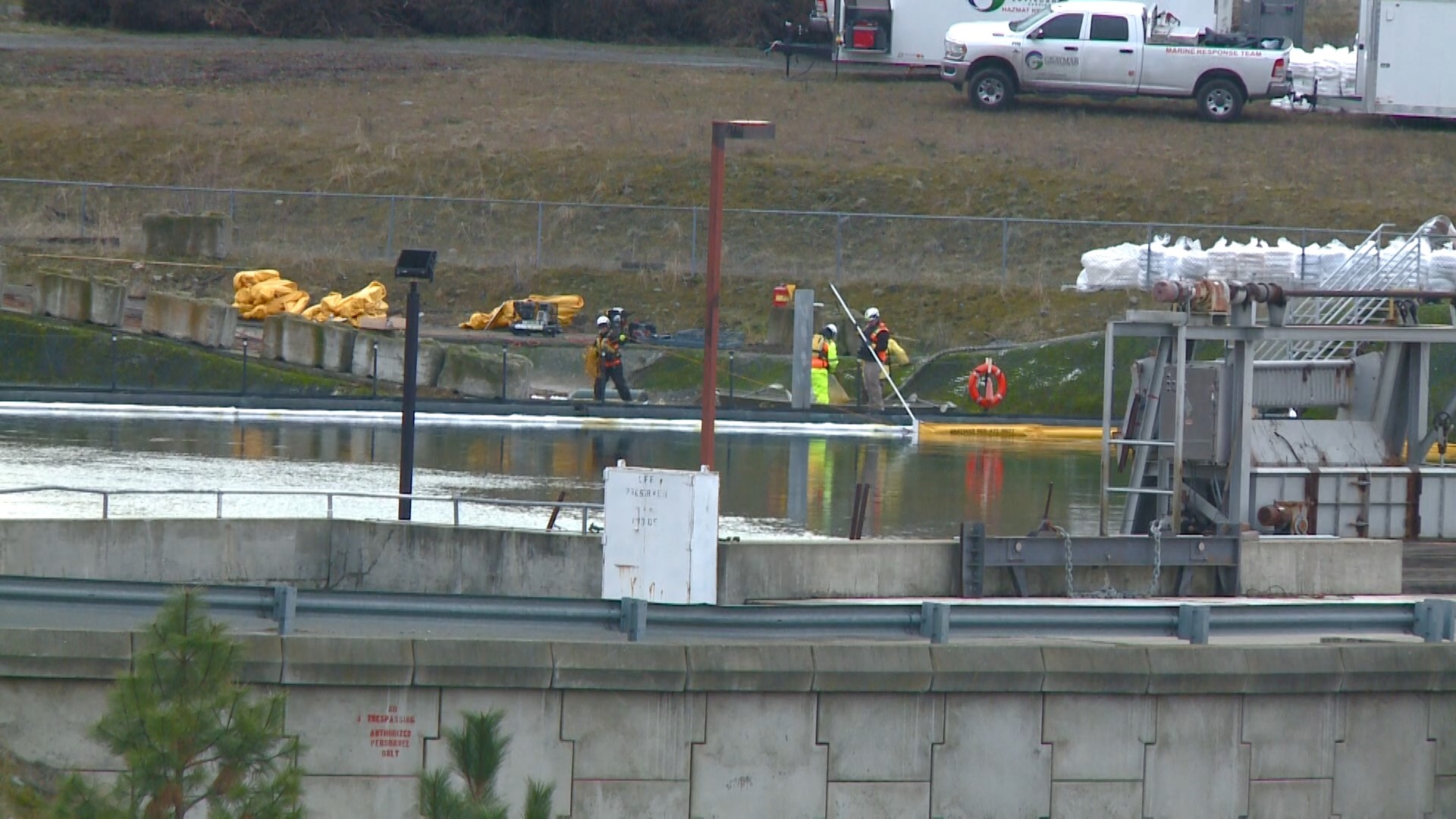 The sheen, which was first spotted on Tuesday, has now started to collect by Upriver Dam.