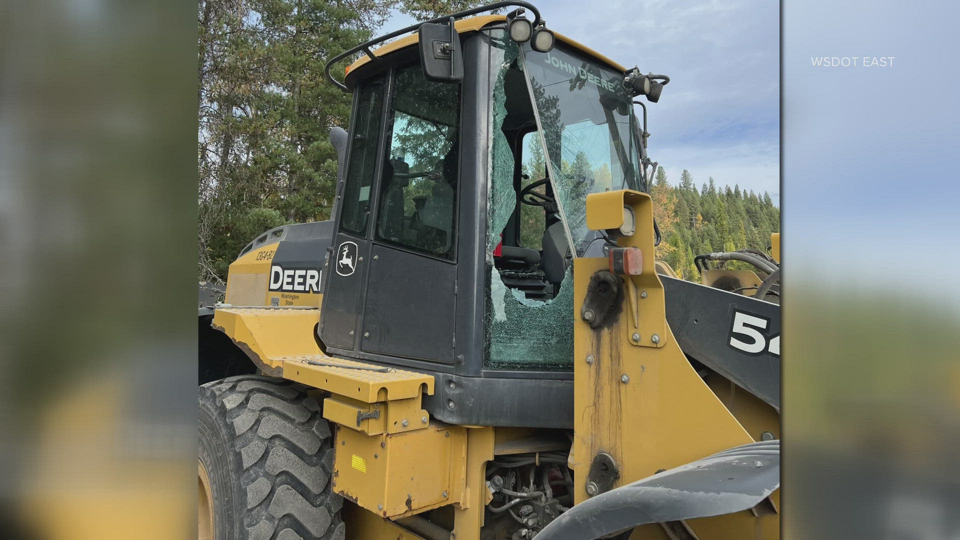 The department shared a photo that showed a smashed window on the front of a front loader that was working on the “Lost Creed Bridge Project.”