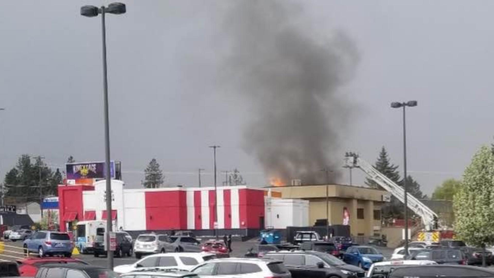 Bystanders took pictures of the blaze that is burning the U.S. Bank right near the KFC.