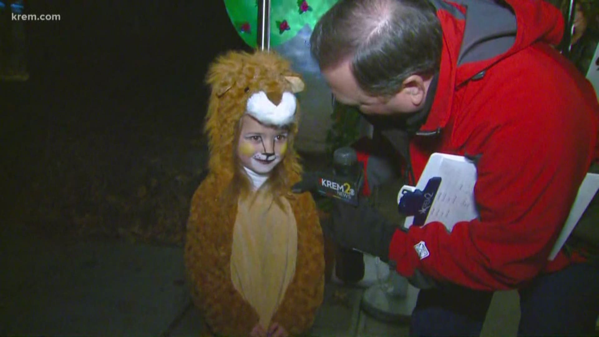 Tom Sherry gives the Halloween forecast from an Alice and Wonderland themed Halloween house on Spokane's South Hill.