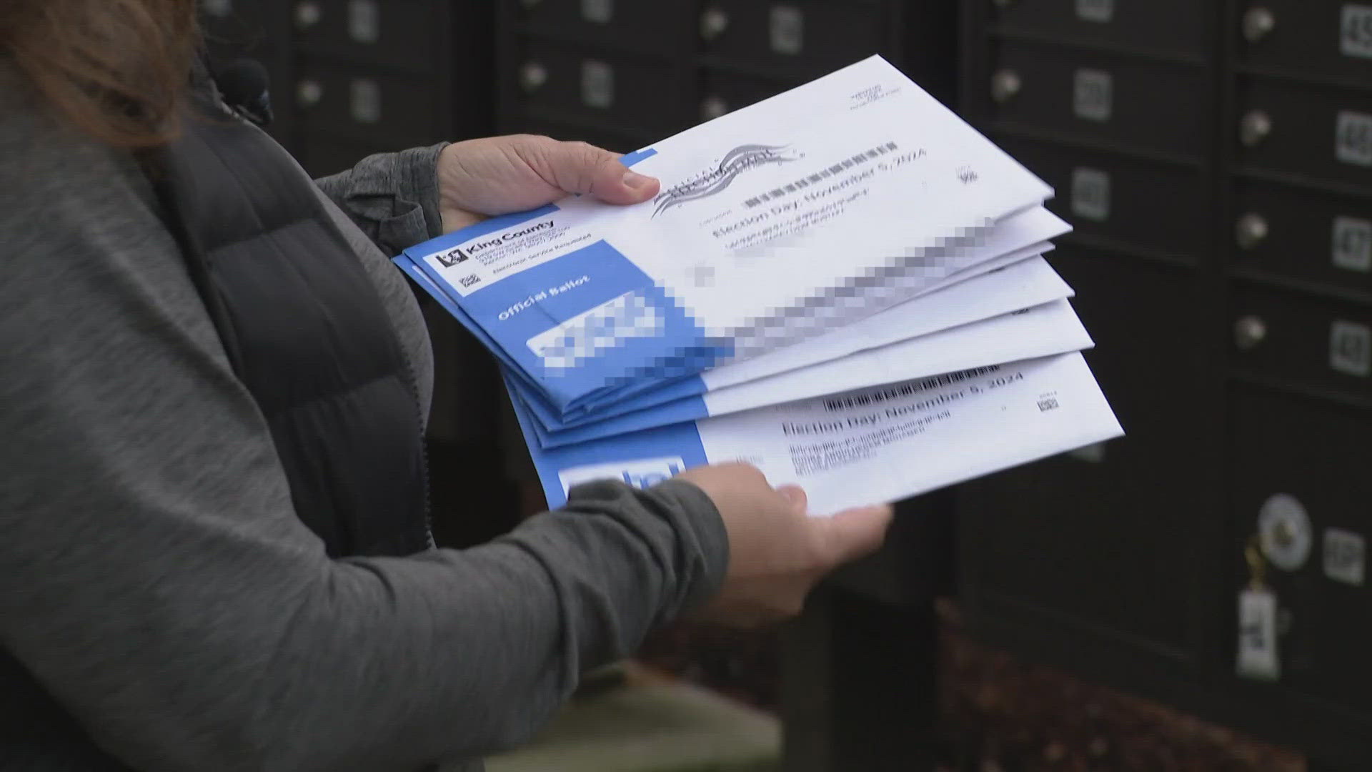 A woman in Bellevue says she received 16 unopened ballots all addressed to her unit under names she had never heard.