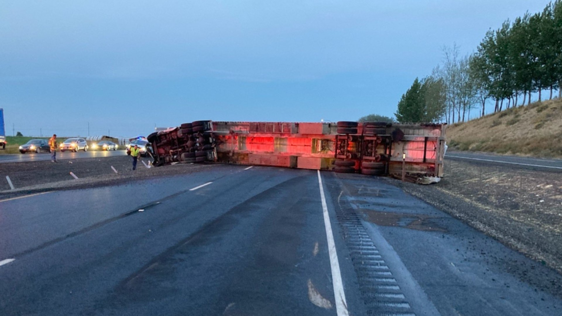 Westbound lanes of I-90 near Warden in Grant County are closed because of a rolled over semi.